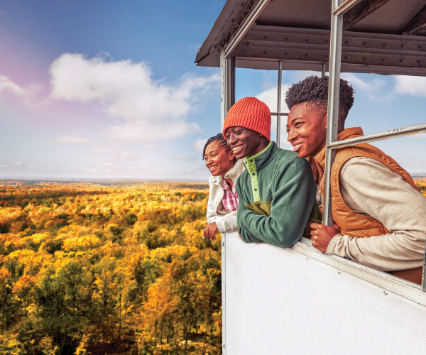 family looking at fall colors from lookout tower 