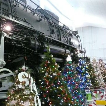 holiday trees displayed in front of locomotive 