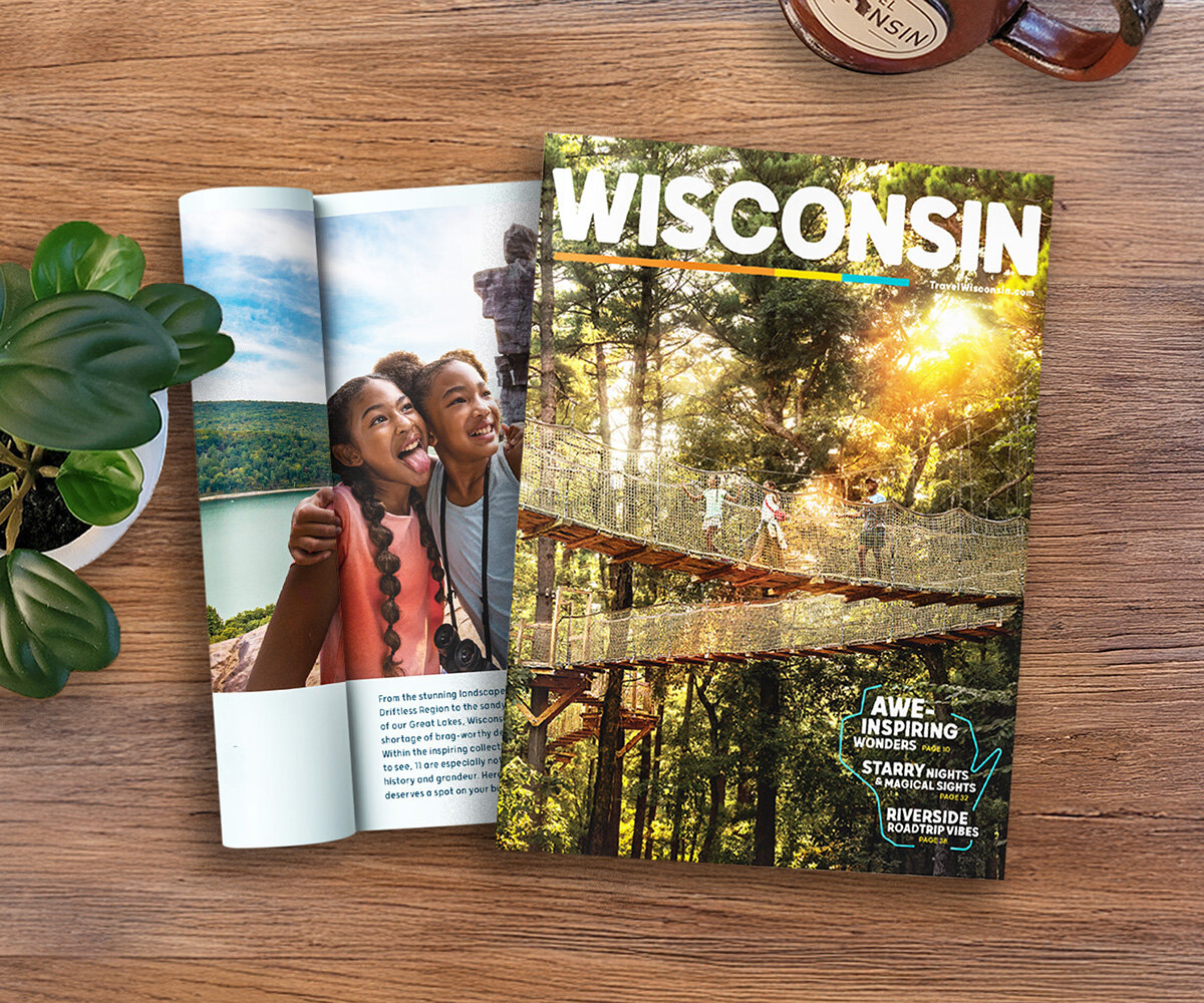 Wisconsin Travel Guide cover and inside page layout sitting on a coffee table