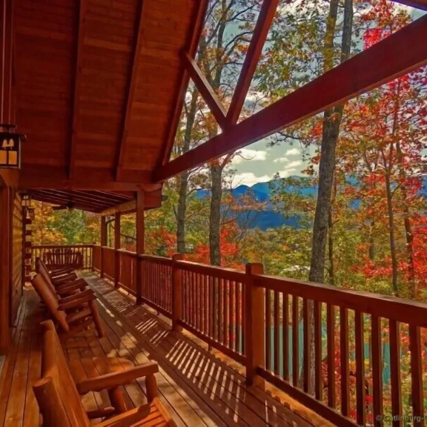 View from the porch of a cabin in the mountains, overlooking fall foliage