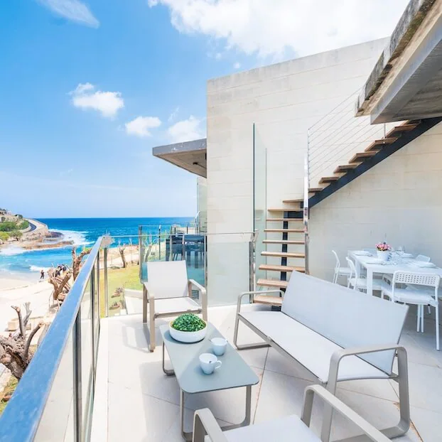 Book a beachfront home.