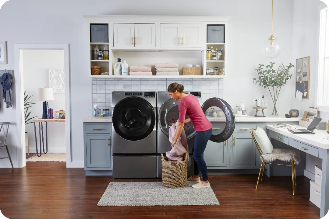 Person putting clothes in washer