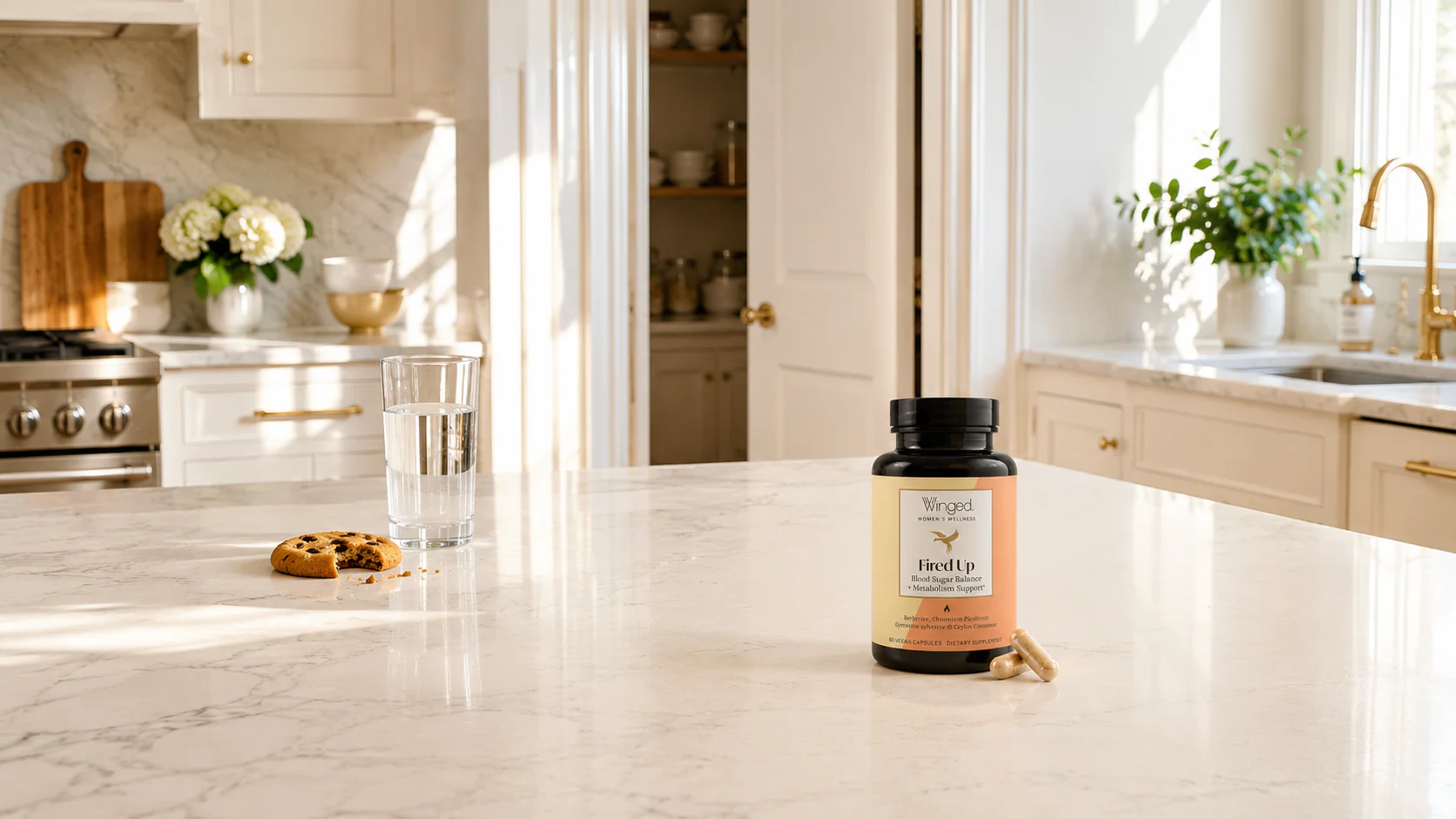 Fired Up bottle in a bright kitchen beside a cookie and glass of water.