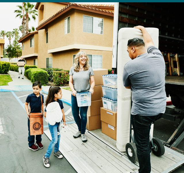 Family Filling Up a Moving Truck 