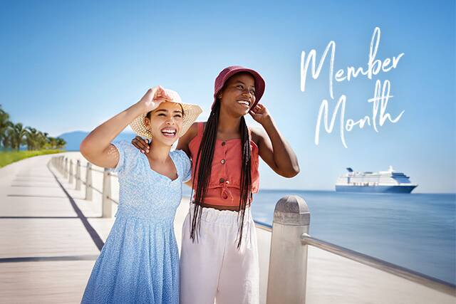 Friends with cruise ship in background