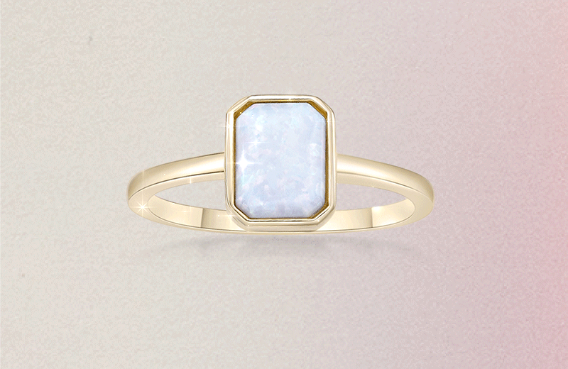 Gif of sparkling Octagon-Shaped Lab-Created Opal Solitaire Ring in Sterling Silver with 18K Gold Plate