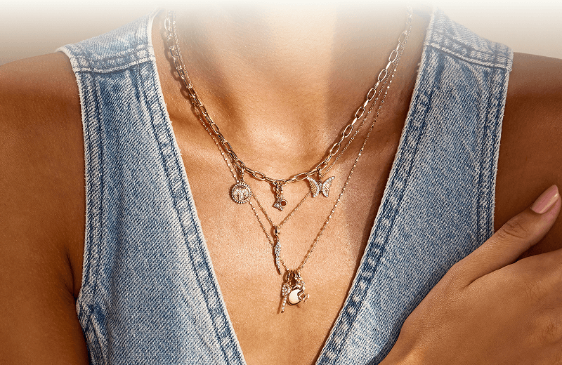 A woman close up, showcasing her beautiful Necklaces.