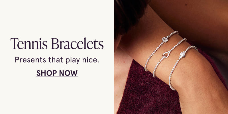 A model wearing three diamond tennis bracelets. Presents that play nice. Click here to shop now