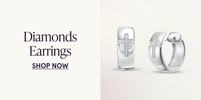 A pair of white metal hoops with a diamond cross design. Diamond earrings. Click here to shop now