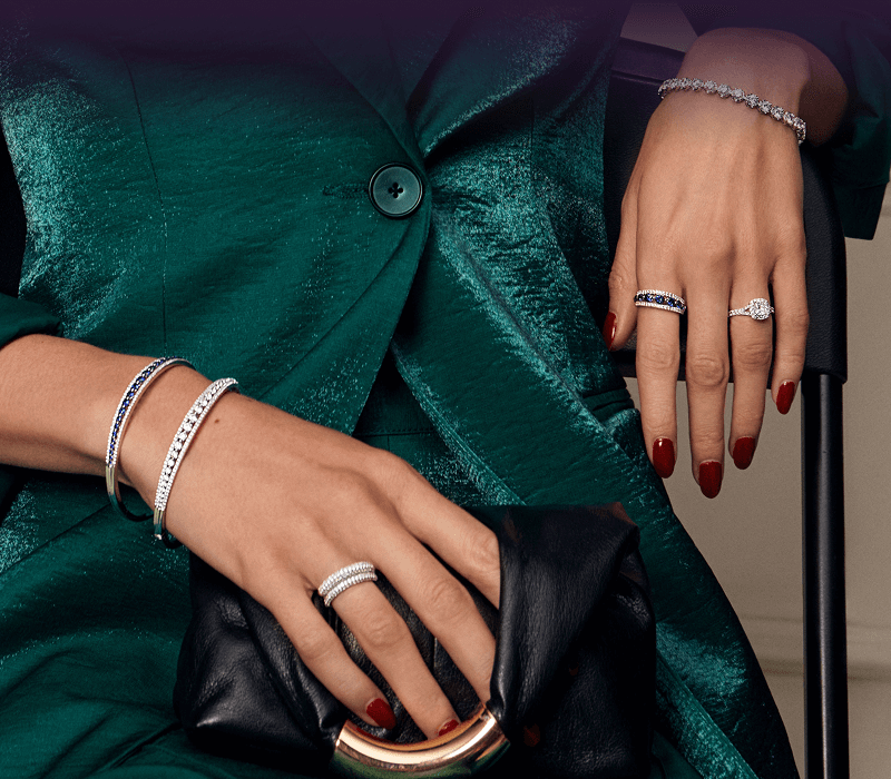 Woman's hands wearing beautiful Rings and Bracelets.