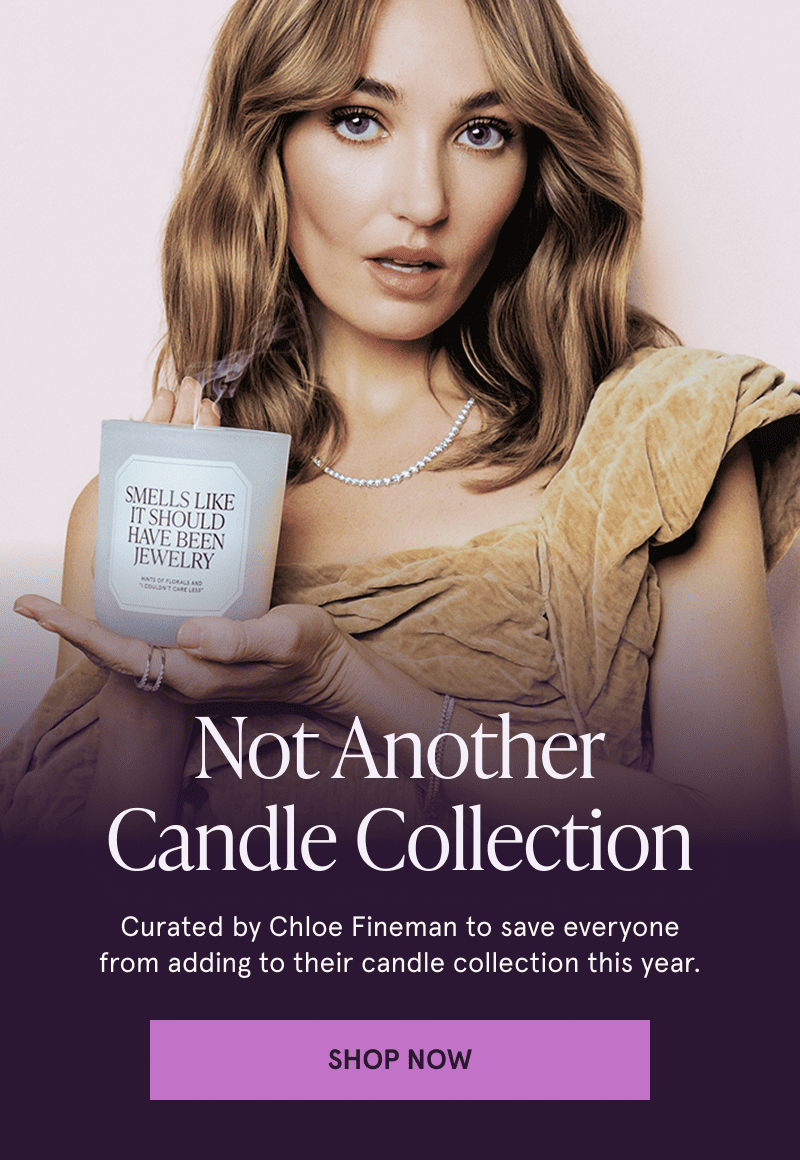 A model wearing Dimond jewelry holds a candle. Not Another Candle Collection. Click here to shop now