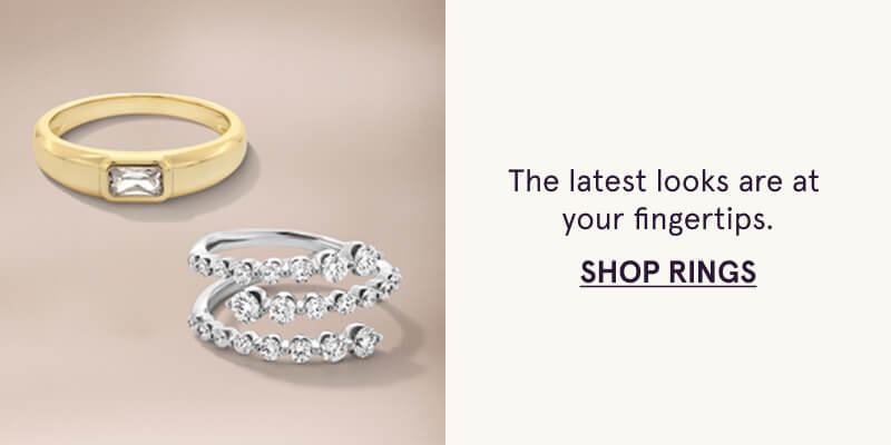 A gold ring with diamond center stone, and wrap-around diamond ring. The latest at your fingertips. Click here to shop rings