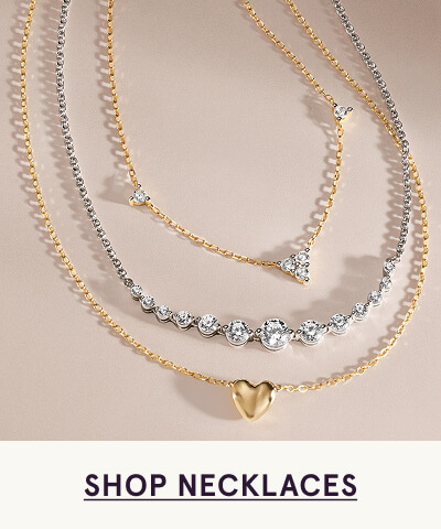 Three layered gold and diamond necklaces with pendants. Click here to shop necklaces