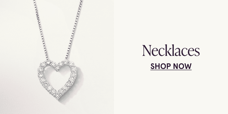 A white metal diamond heart pendant. Click here to shop necklaces