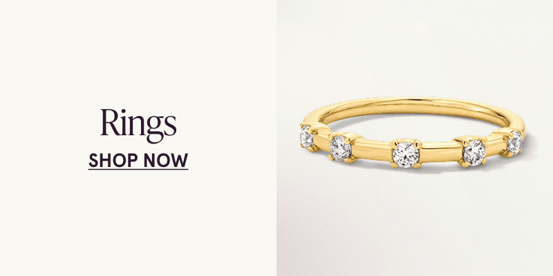 A gold diamond station band. Click here to shop rings