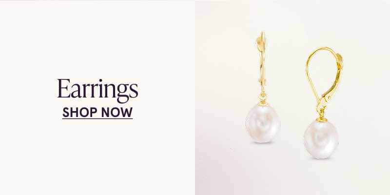 Gold dangling hoop earrings with pearls attached. Earrings. Click here to shop now