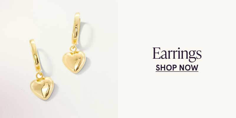Gold hanging huggie earrings with gold hearts attached. Earrings. Click here to shop now