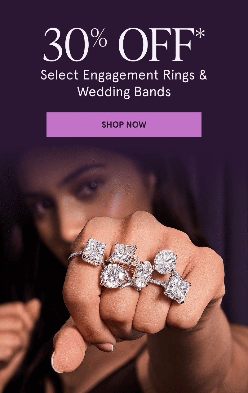 A model wearing a variety of diamond rings. 30% off select engagement rings and wedding bands. Click here to shop now