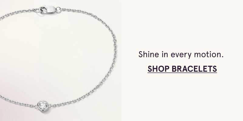 Silver link bracelet with solitaire small round-cut diamond pendant. Shine in motion. Click here to shop bracelets