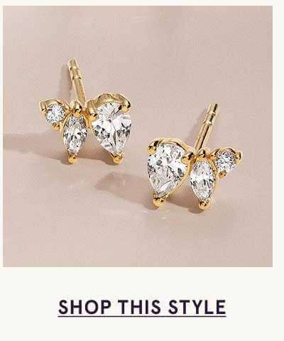 Pair of gold studs with clustered asymmetrical gemstones: Pear, marquise & round-cut. Click here to shop this style