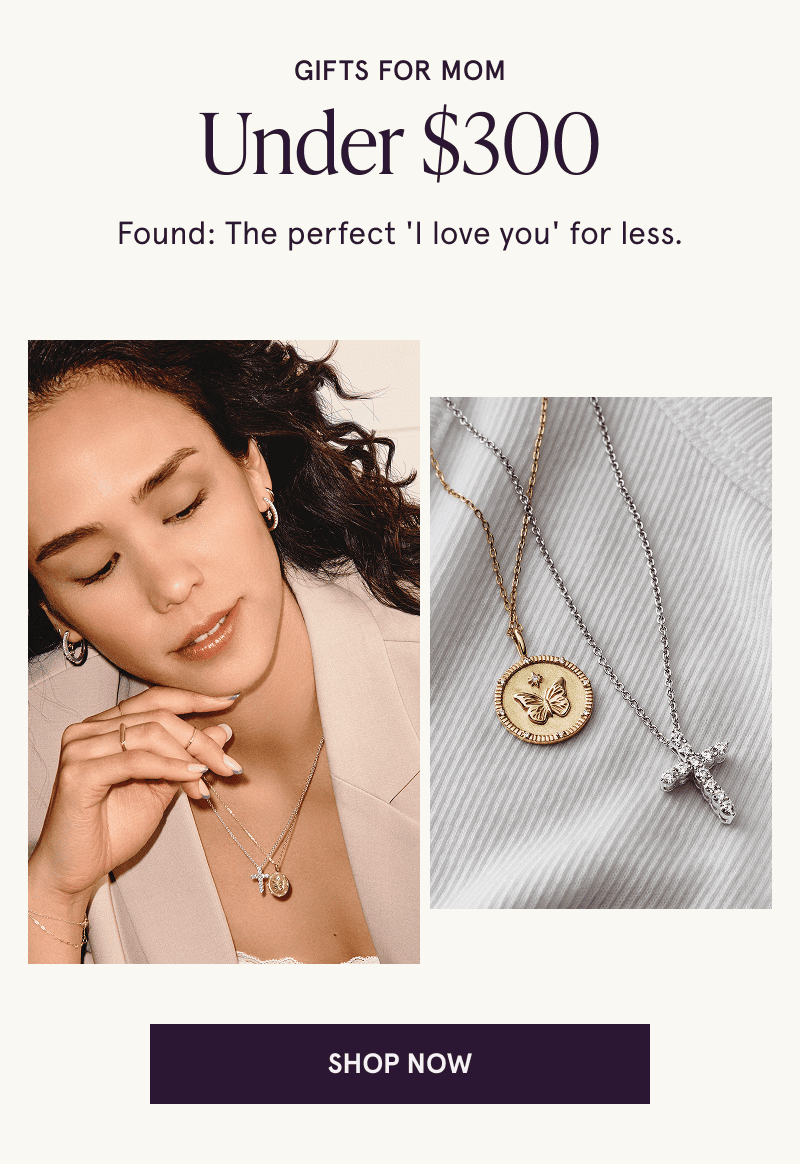 Gifts for mom under $300. “I love you”, for less. Model in hoops wearing diamond cross & gold butterfly medallion pendants on chains, next to product close-up.  Click here to shop now