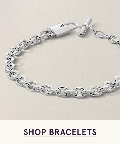 Silver cable-link chain bracelet with padlock charm & toggle clasp closure. Click here to shop bracelets