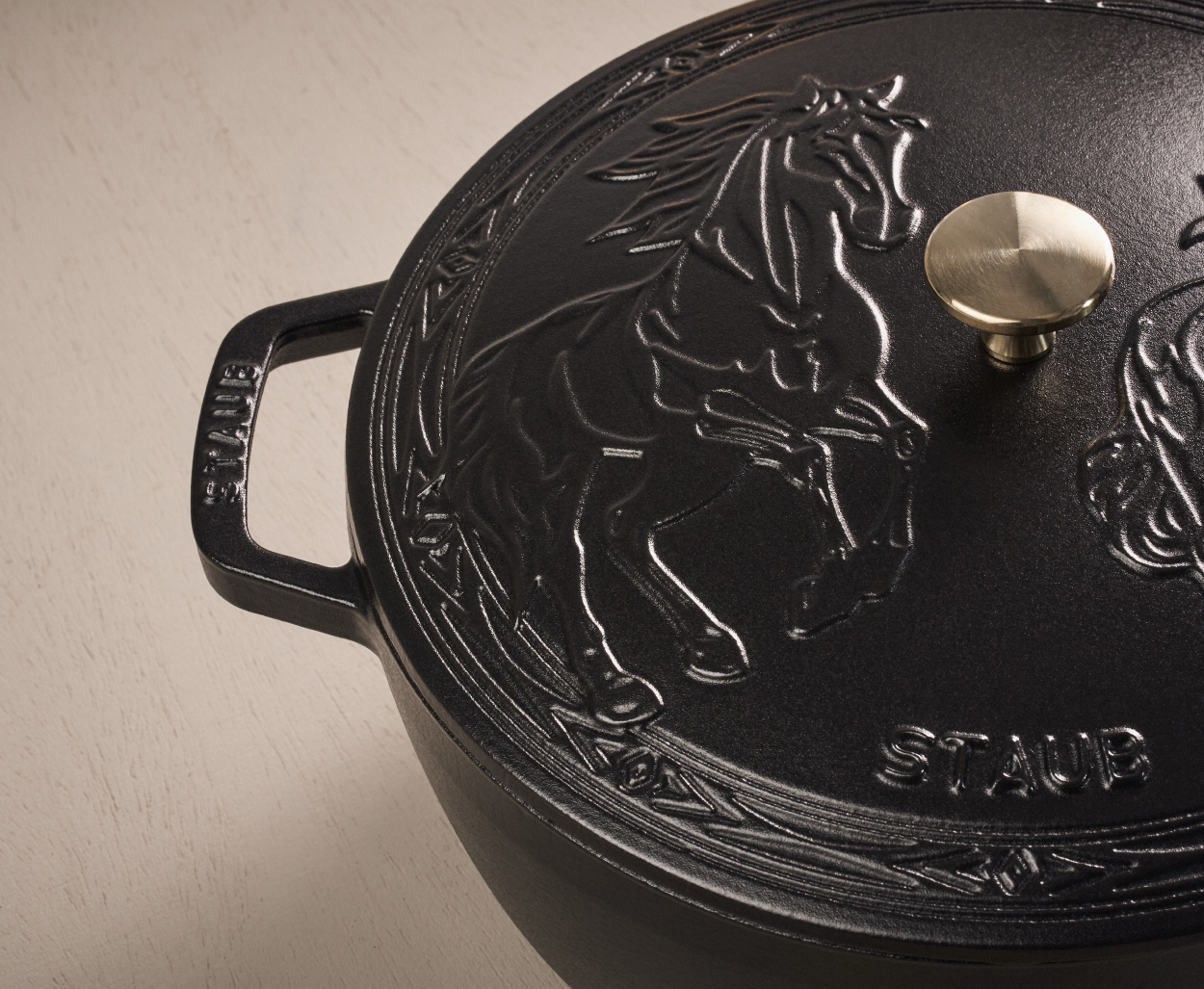 The French Oven: Serves 4-6, matte black enameled interior, self-basting lid for moisture retention.